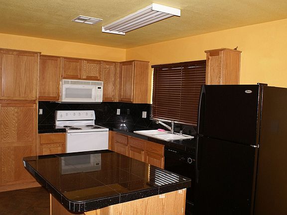 Kitchen with Granite counter Tops and Tile Floor