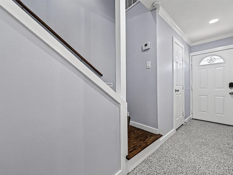 This is the view from inside toward the front door and the staircase to the 2nd floor.