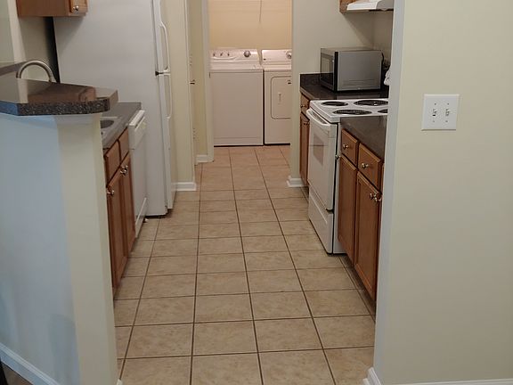 Kitchen and laundry room with washer and dryer