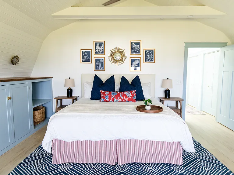 The master room includes a king size bed, built-in closet space, a dresser, a desk, and a smart TV