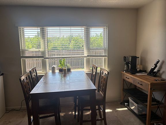 Dining looks into fenced yard