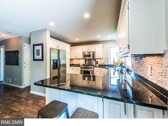 New granite tops and SS appliances in updated kitchen