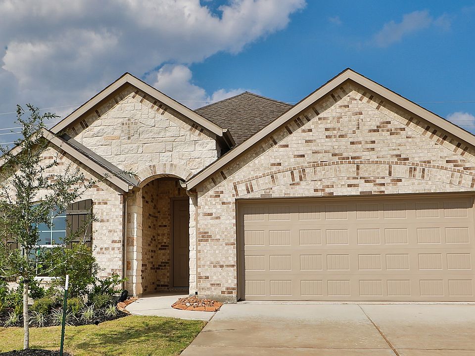Experience opulent design with brick facade, arched windows, and pristine landscaping in Westland Ra