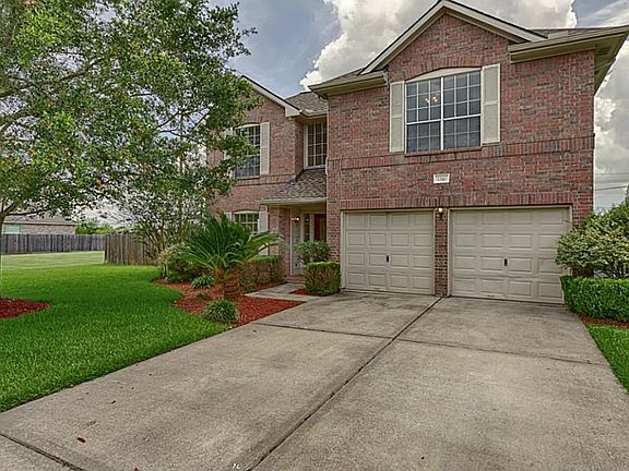 attractive landscaping and a great shady oak