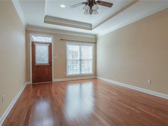 Sunny views and an easy to use electric fireplace warm up this living room.