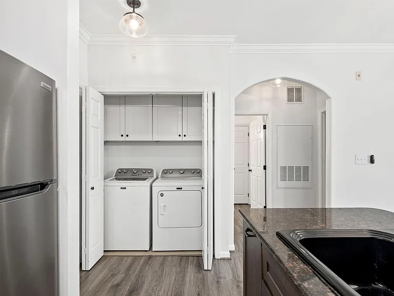 Laundry area with new storage cabinets