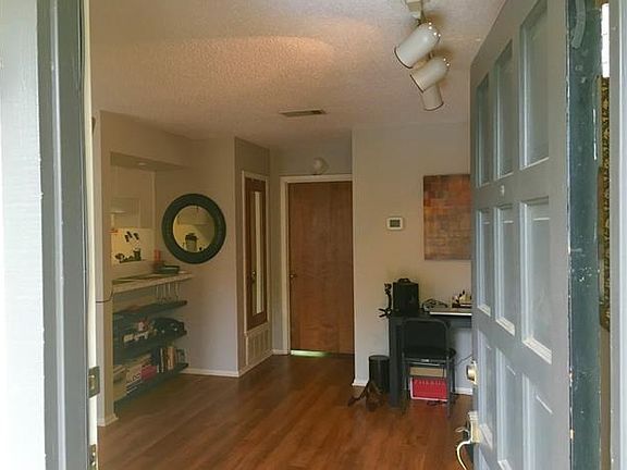 front door opened into living area.  Door closed is the bedroom