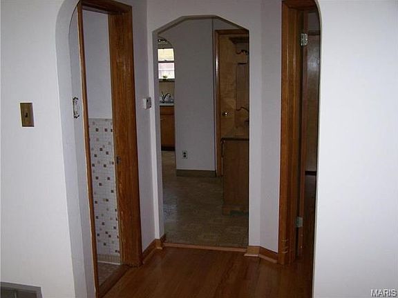 Just refinished in December 2015 Wonderful hardwood floors in LR, Bedrooms, hallway, Note the charming arches and style of this all brick home!
