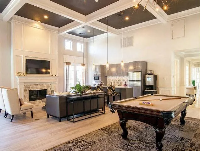Club room with pool table, kitchen and fire place
