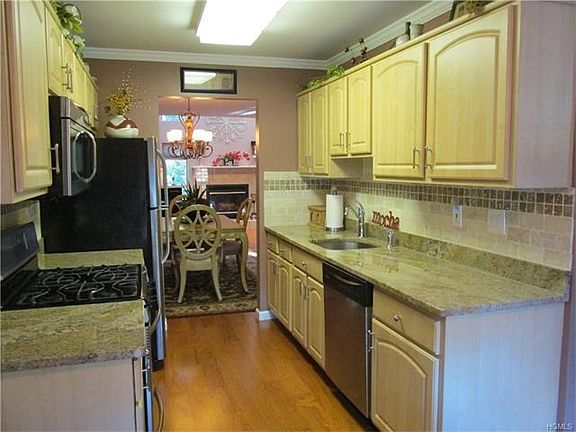 Updated eat in Kitchen with Granite counter tops, stainless steel appliances