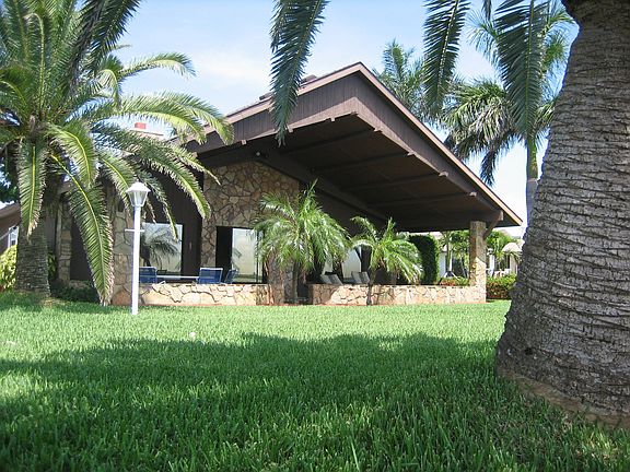 Lush yard with covered lanai