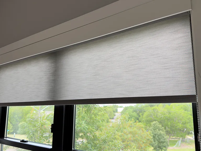 Modern roller shades throughout the home offer a sleek, contemporary design with a clean-lined valance. They provide privacy while filtering natural light, creating a bright, inviting atmosphere, and a polished finish in every room.