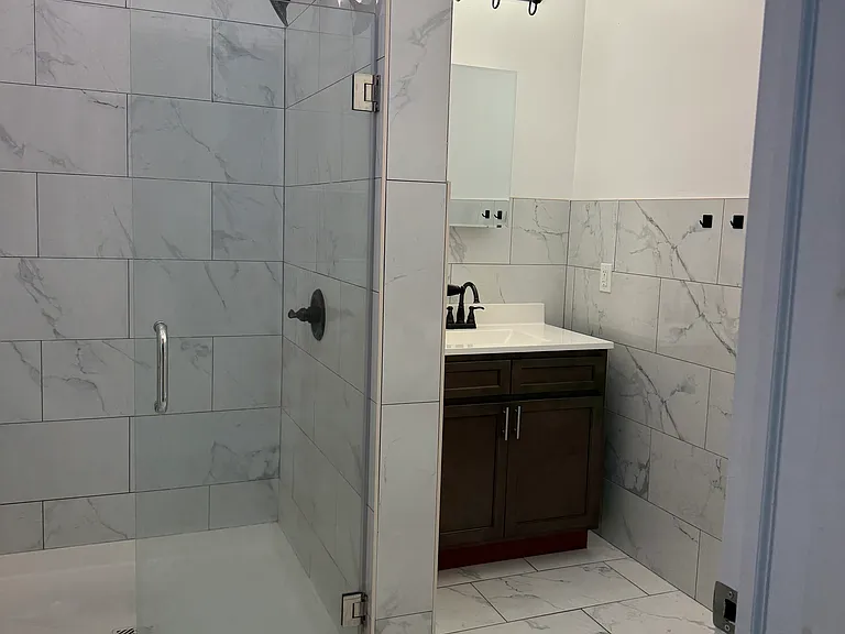 Bathroom with oversized shower and high ceiling