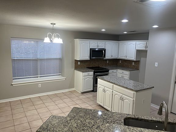 Dining nook off of kitchen. Very open feel.