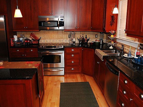 SS Appliances, Granite Counter Tops, Cherry Cabinets
