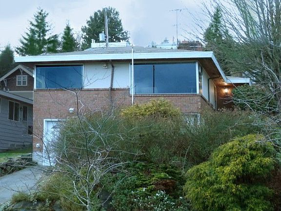 Classic 1965 built home. Situated high up off street with territorial views. Brick and wood exterior