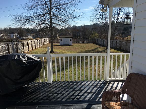 Large fenced yard, building