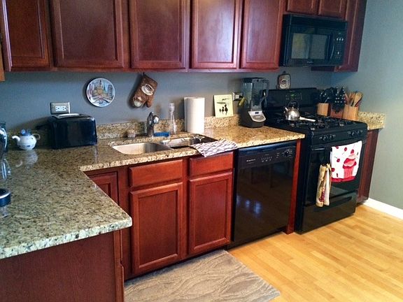 Updated eat-in kitchen with newer appliances, maple cabinets