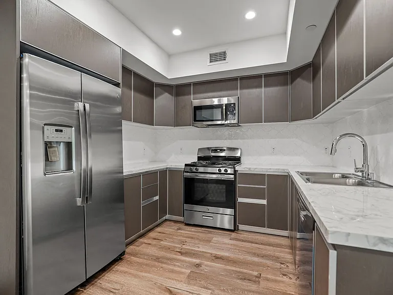 Kitchen with Energy-Efficient Appliances and Ample Cabinet Storage