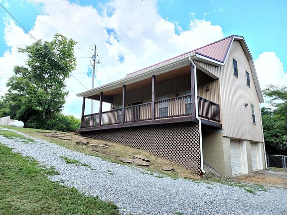 Big, newly stained, covered front porch 2 Car Garage Underneath