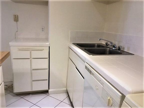 New tiled counters and dishwasher