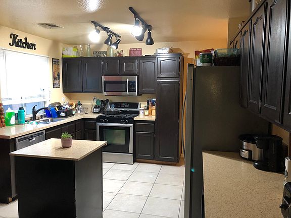 Kitchen updated in 2018 with new quartz countertops, sink, faucet, lighting and additional island. Microwave, dishwasher, cook top/oven included. Refrigerator available for use is not pictured. *refrigerator pictured is NOT INCLUDED