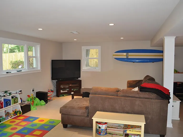 finished basement with laundry, utility, storage, bedroom, f