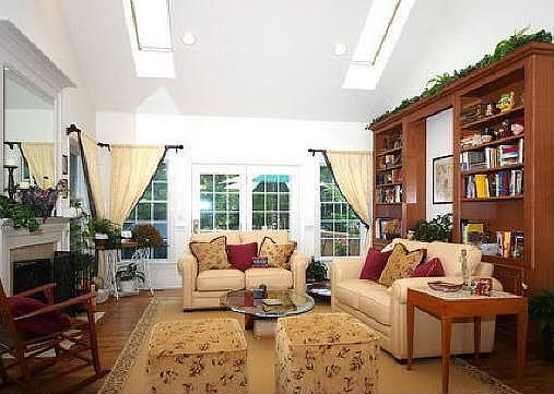 Spacious Living Room with fireplace and built-in shelves