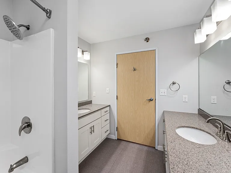 Modern bathroom with sleek countertops, elegant fixtures, and spacious cabinetry exuding contemporary style. Modern bathroom with sleek countertops, elegant fixtures, and spacious cabinetry exuding contemporary style.