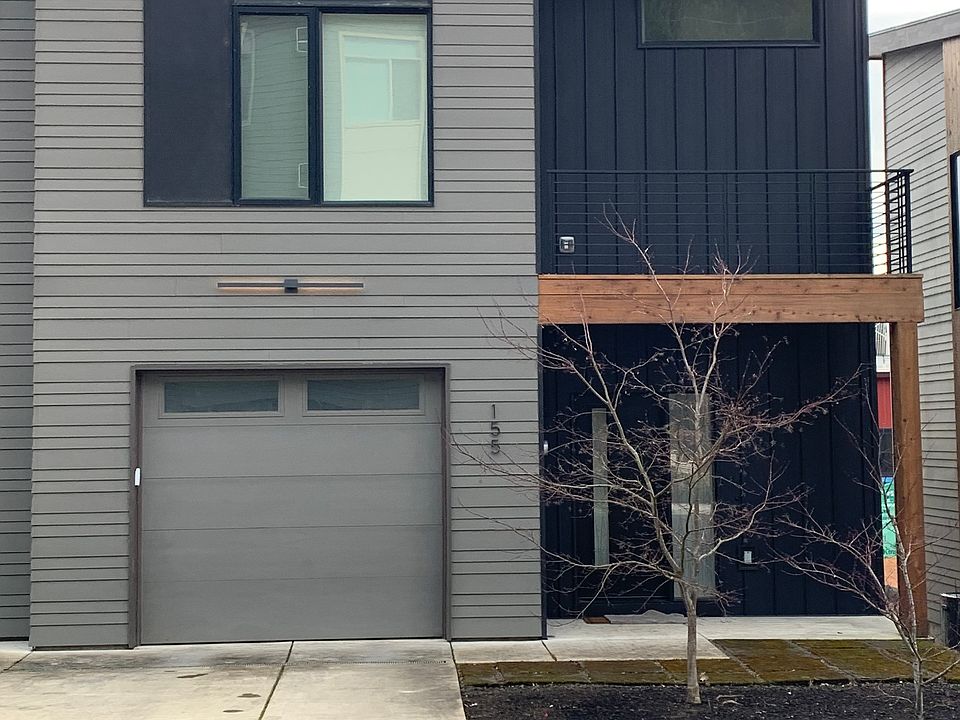 Single car garage with parking space for second vehicle on driveway. Deck accessible through master bedroom.