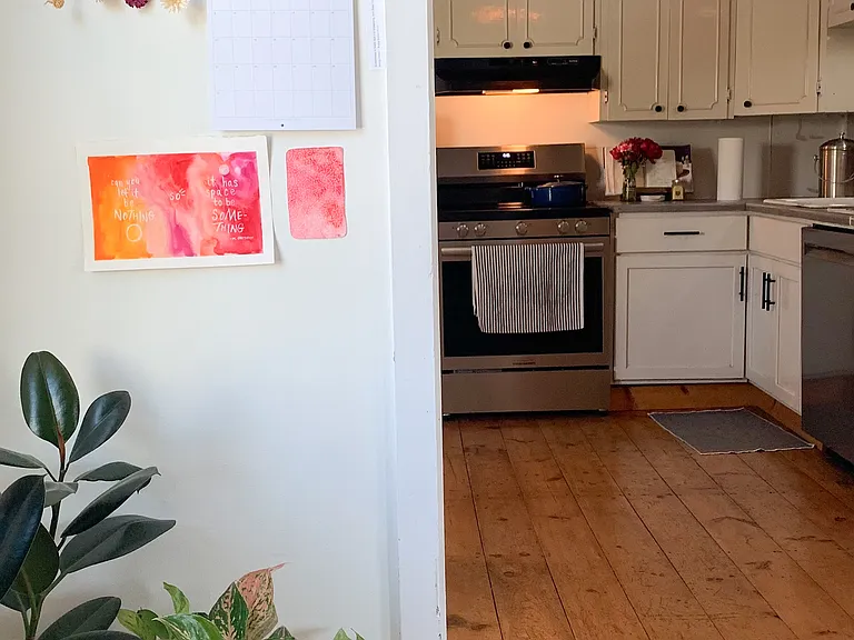Little office or reading nook looking into kitchen