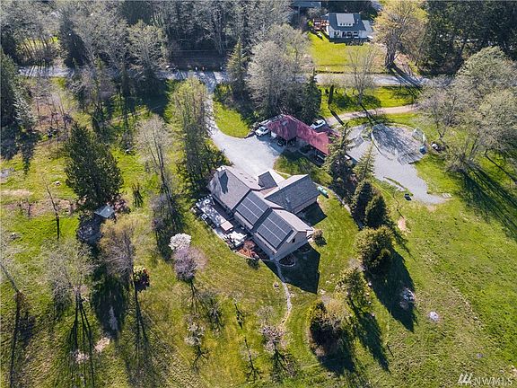 Home is located on 16+ acres - half pasture half with mature conifers and deciduous trees.