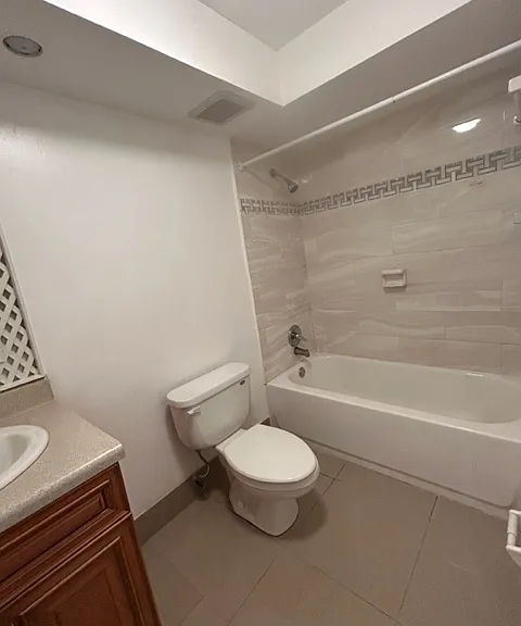 full bathroom with tub and shower, newly tiled