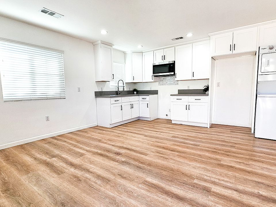 Kitchen is open and modern.