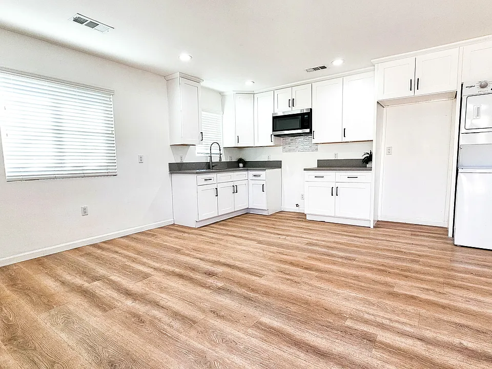 Kitchen is open and modern.