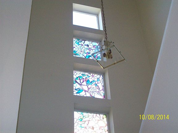 Stain glasses on the wall of stairs case