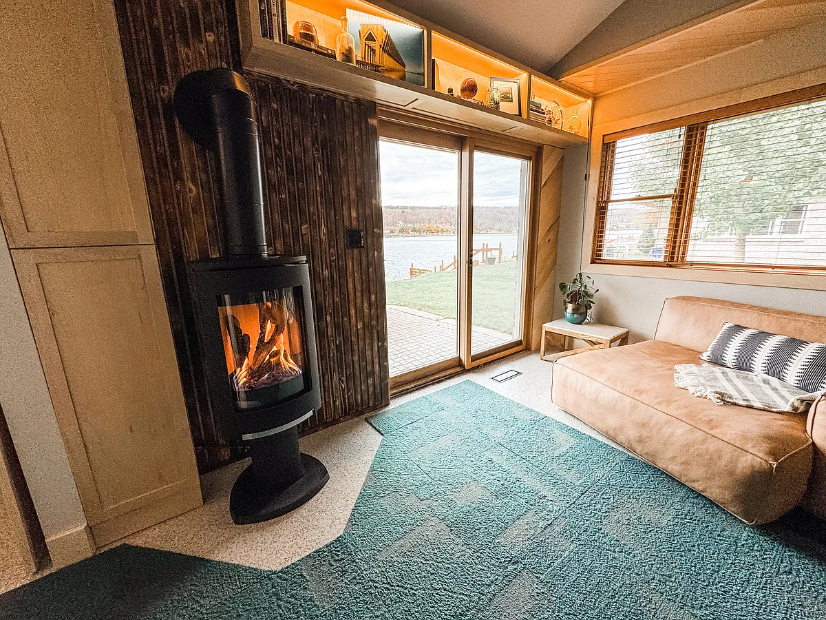 Modern fireplace with storage nook and a brick patio overlooking the Portage Canal. - 322 Navy St