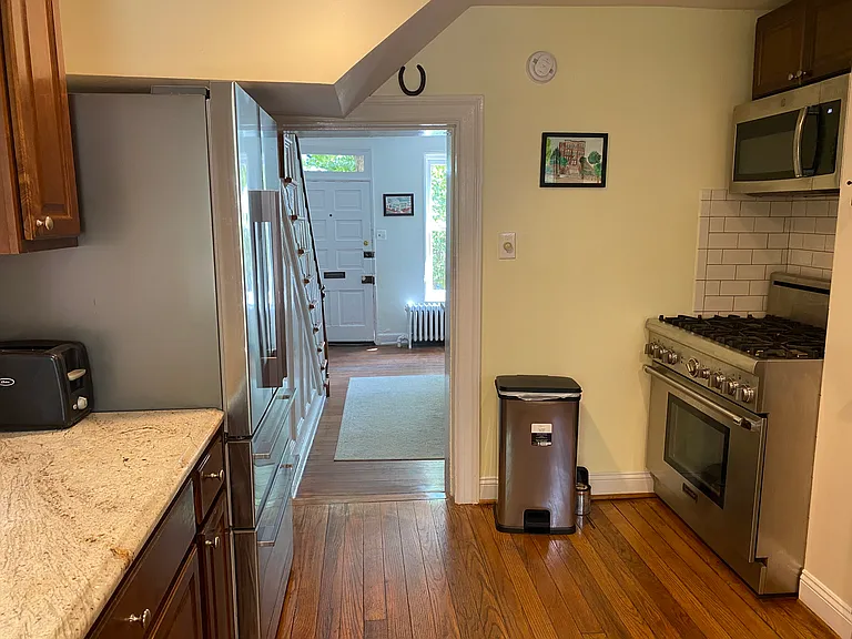 kitchen offers stainless steal appliances, gas stove, hardwood floors, counter seating for 1, stone counters, coffee makers, small appliances.