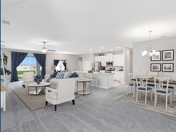 Enjoy a spacious and open living area shown with optional wrap-around, counter-height breakfast bar