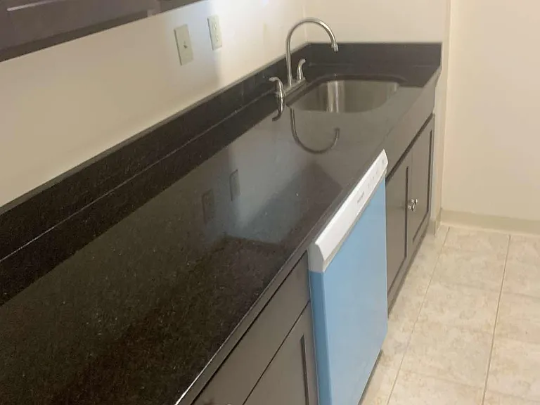 Gleaming Granite with inset stainless steel sink