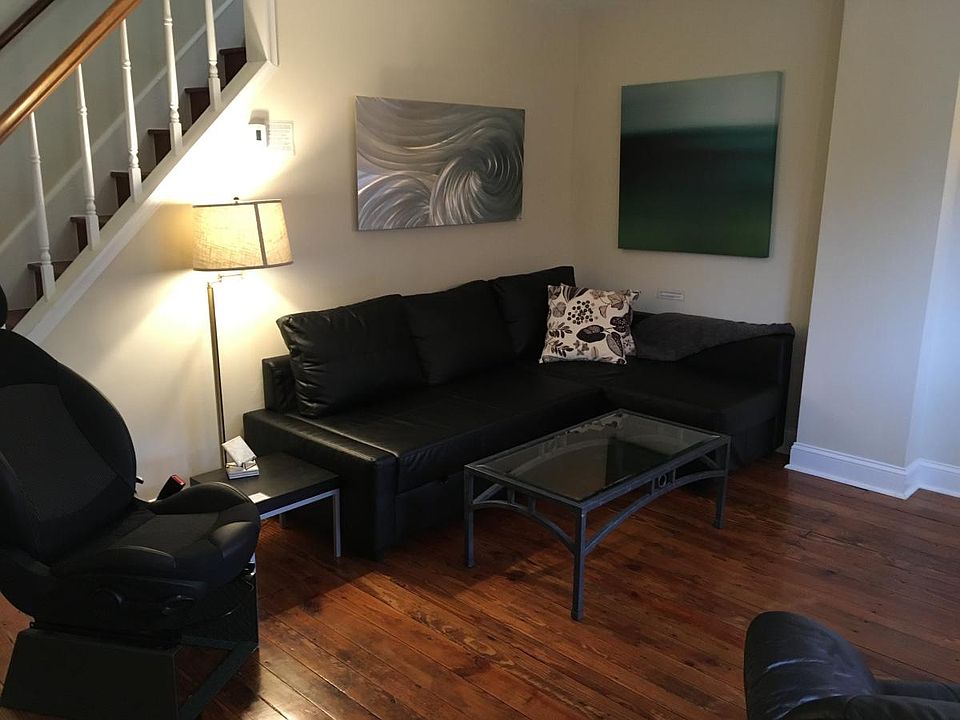 Living room with sofa bed and 4K TV