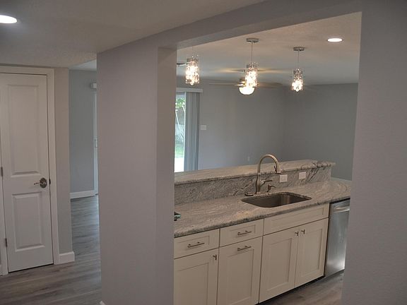 View from Foyer: Coat Closet & Kitchen