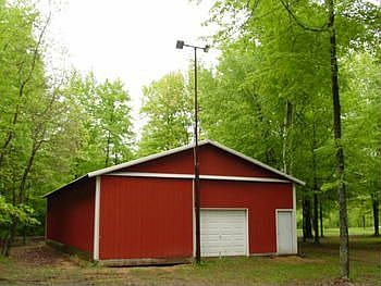 Here is the back pole barn, it features doors on both ends for easy drive through storage.