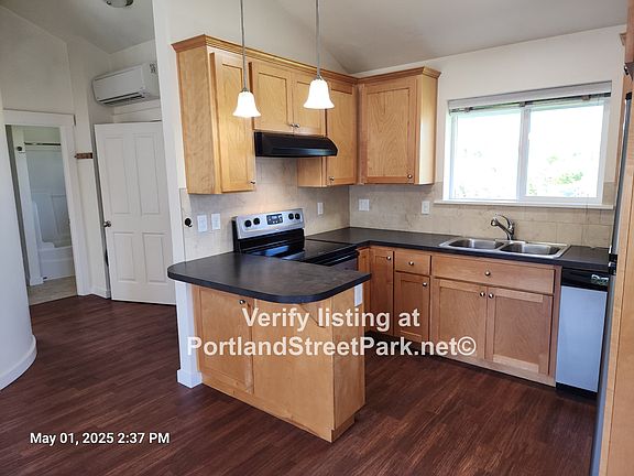 Open concept, kitchen w/ custom cabinets