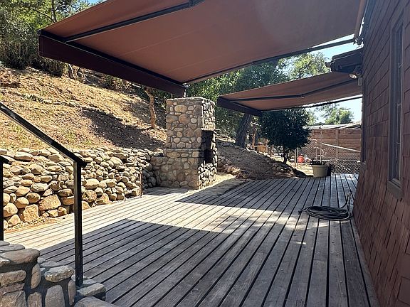 Motorized retractable awnings covering the entire backyard patio! Amazing for Ojai summer days.