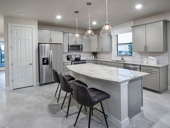 Model Representation Gourmet kitchen with stainless steel gas appliances quartz countertops