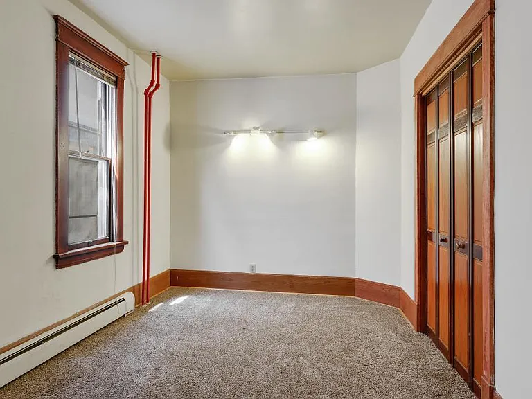 Spacious bedroom with a large closet and brand new carpet
