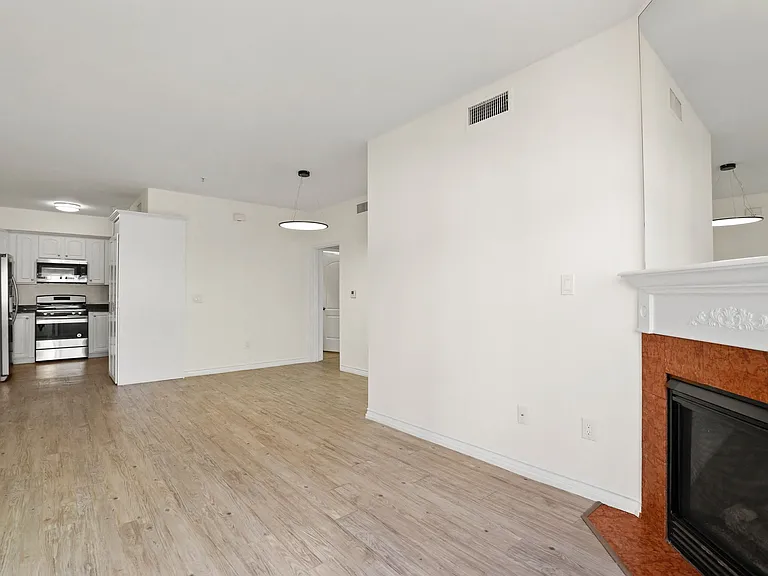 Open-Concept Dining and Living Room with Electric Fireplace