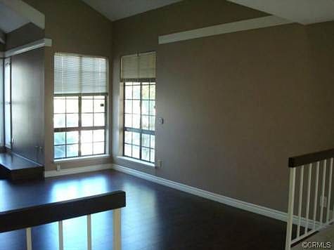 Spacious living room with vaulted ceiling, fireplace and sea