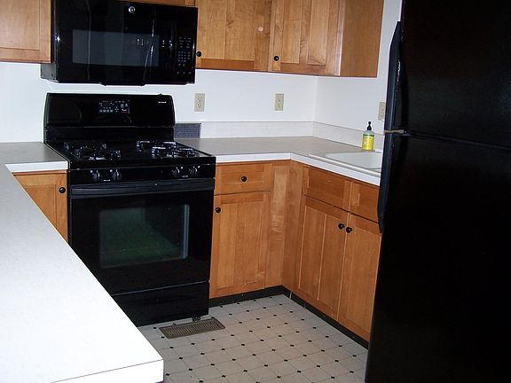 fully applianced kitchen with bosch dishwasher, frig with ice maker, and bottom freezer. microwave, Gas stove.